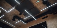View on modern led lightning hanging from ceilings, industrial building concrete texture